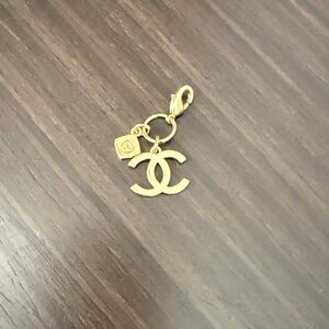 CHANEL Gold Logo Brooch